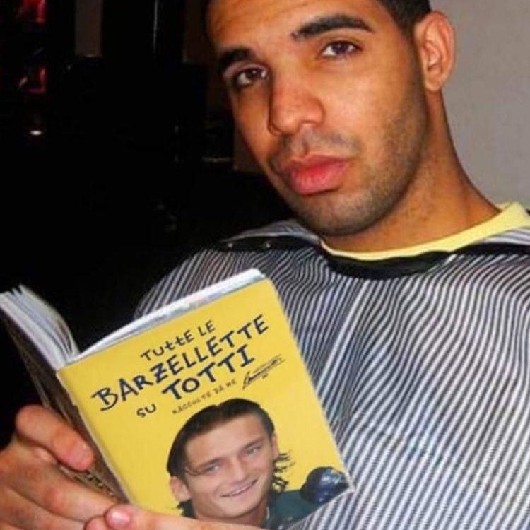 Drake is reading "Le barzellette di Francesco Totti" italian book.